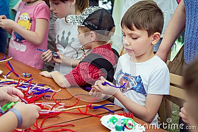 Children participating at art and craft outdoor workshop Editorial Stock Photo